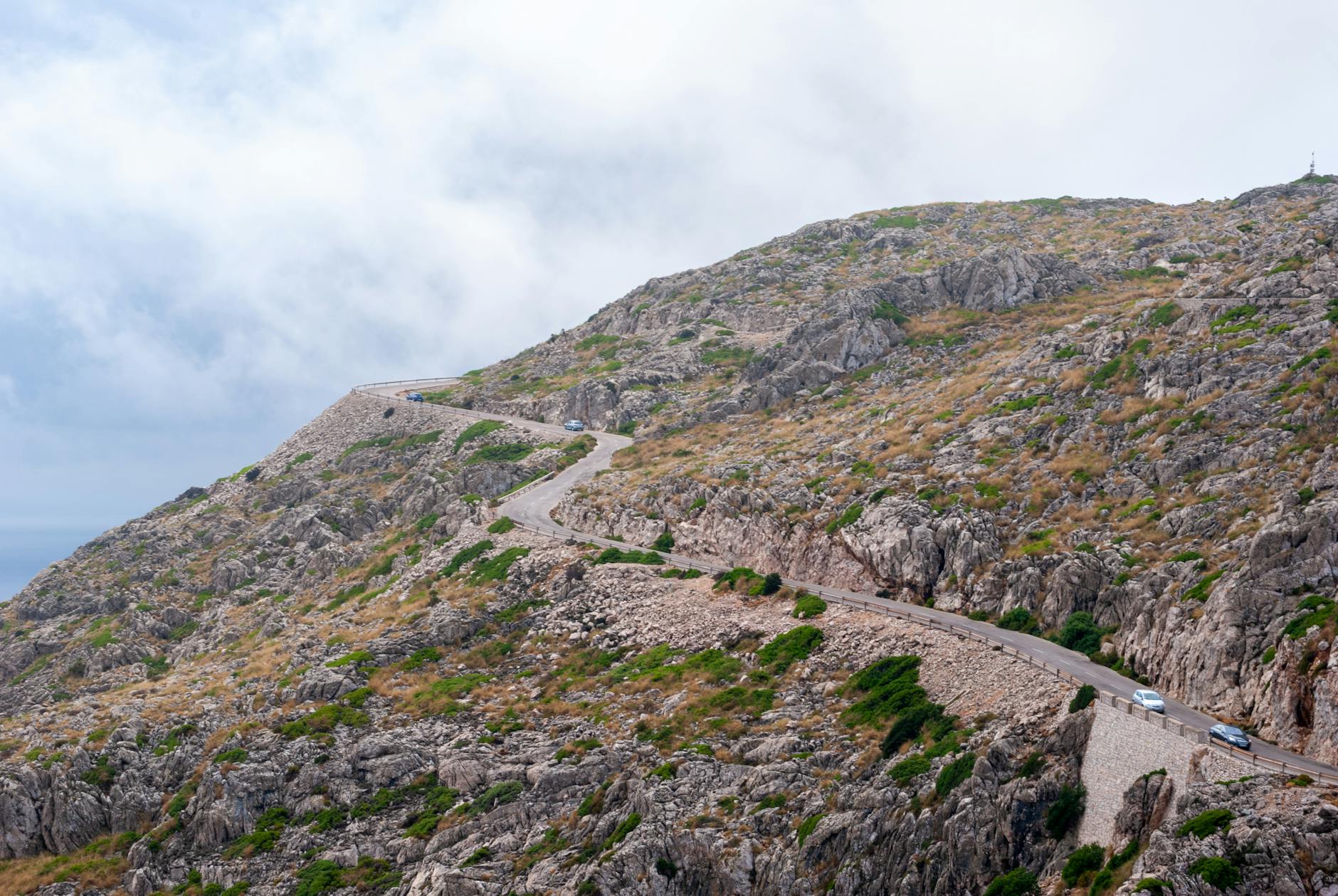an asphalt road going up the hill